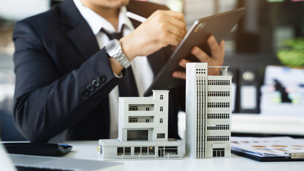 House model with agent asking costumer for contract to buy, get